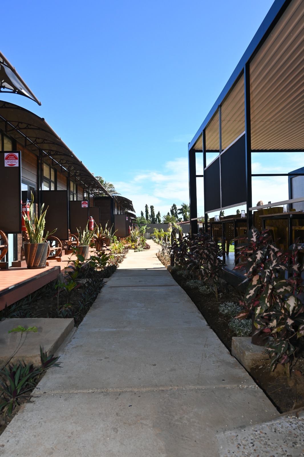 Landscaped garden walkway between the room decks